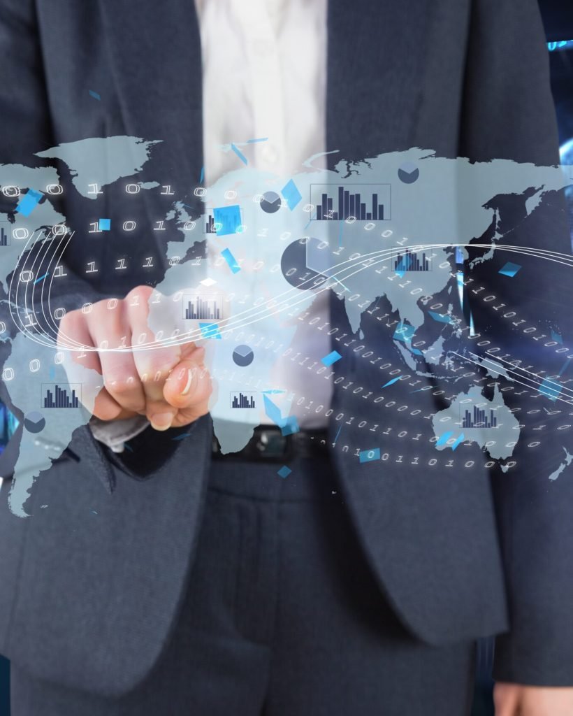 composite of businessman pointing at graphics
